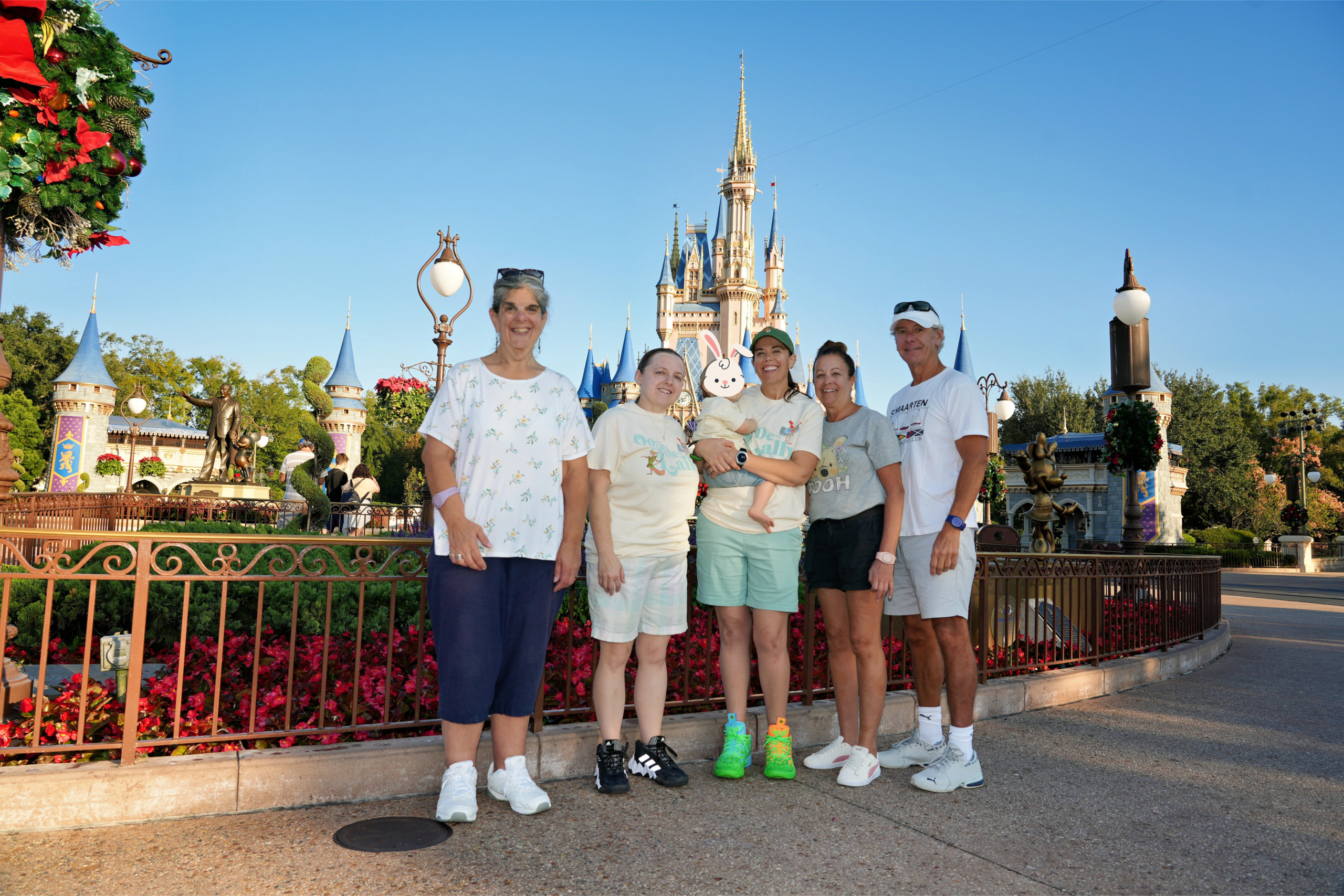 Family photo in front of Cinderella's castle in Magic Kingdom in Disney World
