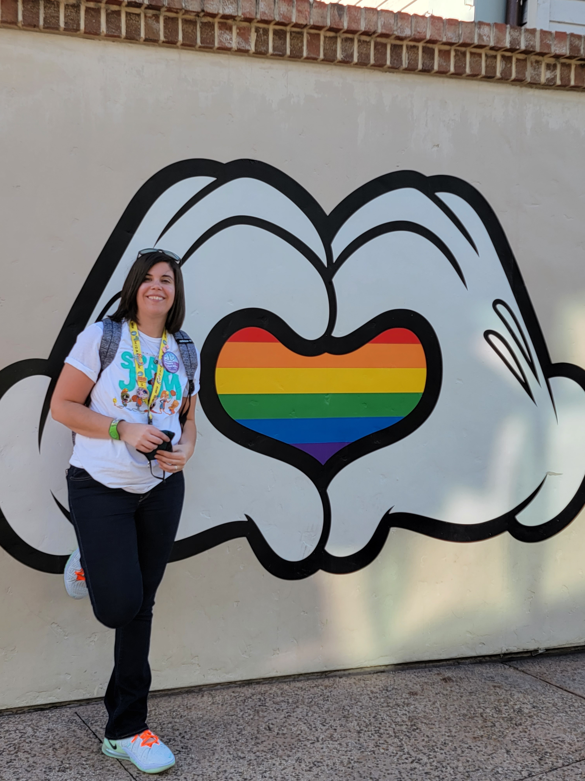 Nicole in front of pride mural at Disney World